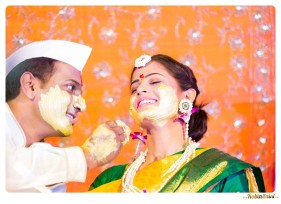 bride-groom-putting-haldi
